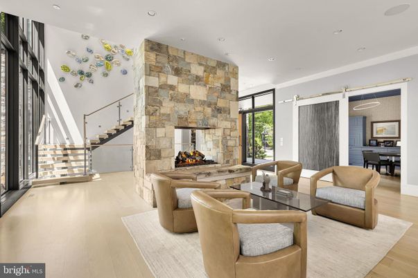 Dining room, Fireplace, Interior, Living room, Recessed Lighting, Stone Walls, Wood Texture Flooring