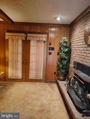 Fireplace, Fitness Equipment, Interior, Recessed Lighting, Stone Walls, Wooden Walls