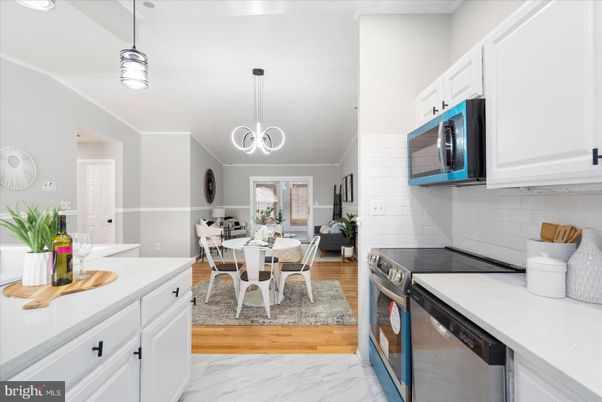 Dining room, Interior, Kitchen, Marble, Pendant Lights, Stainless Steel Appliances, Wood Texture Flooring