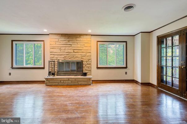 Empty room, Fireplace, Interior, Recessed Lighting, Stone Walls, Wood Texture Flooring