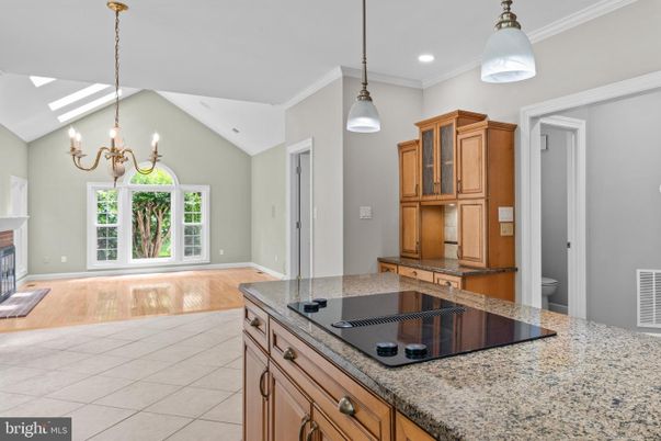 Chandelier, Fireplace, Interior, Kitchen, Pendant Lights, Recessed Lighting, Wood Texture Flooring
