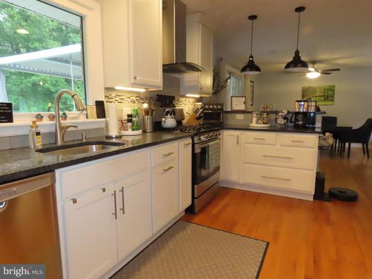 Dining room, Interior, Kitchen, Pendant Lights, Recessed Lighting, Stainless Steel Appliances, Wood Texture Flooring