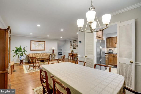Chandelier, Dining room, Interior, Kitchen, Living room, Recessed Lighting, Stainless Steel Appliances, Wood Texture Flooring