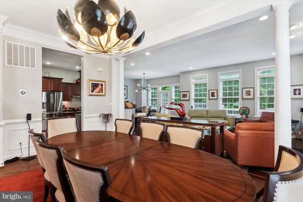 Chandelier, Dining room, Interior, Kitchen, Living room, Pendant Lights, Recessed Lighting, Stainless Steel Appliances, Wood Texture Flooring