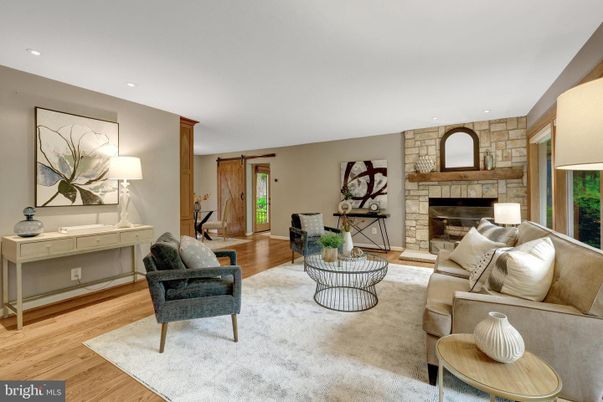 Fireplace, Interior, Living room, Recessed Lighting, Stone Walls, Wood Texture Flooring