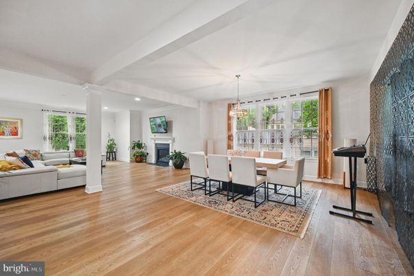 Chandelier, Dining room, Fireplace, Interior, Living room, Pendant Lights, Recessed Lighting, Wood Texture Flooring