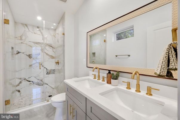Bathroom, Dual Sink Vanities, Glass Shower, Interior, Marble, Marble Walls, Recessed Lighting
