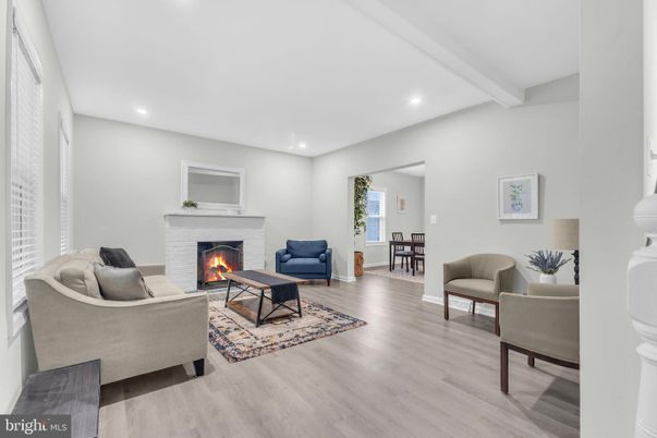 Dining room, Fireplace, Interior, Living room, Recessed Lighting, Wood Texture Flooring
