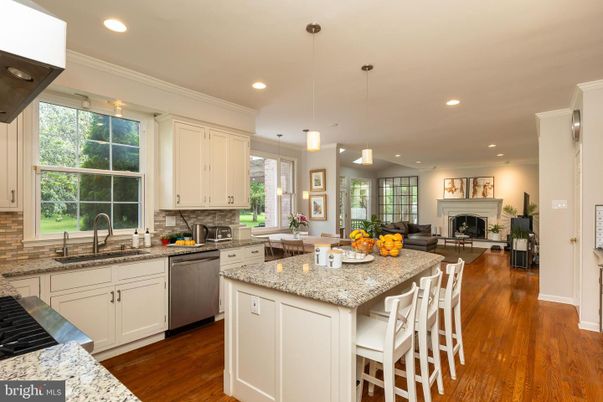 Fireplace, Interior, Kitchen, Living room, Pendant Lights, Recessed Lighting, Stainless Steel Appliances, Wood Texture Flooring