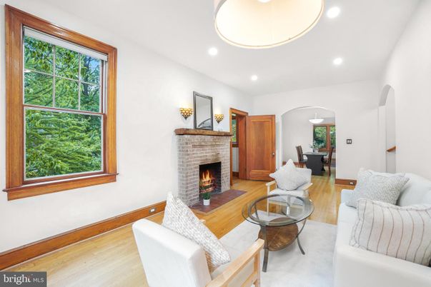 Dining room, Fireplace, Interior, Living room, Recessed Lighting, Wood Texture Flooring