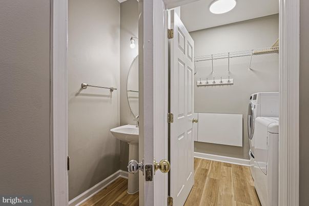 Bathroom, Interior, Recessed Lighting, Walk-in Closets, Washer, Wood Texture Flooring
