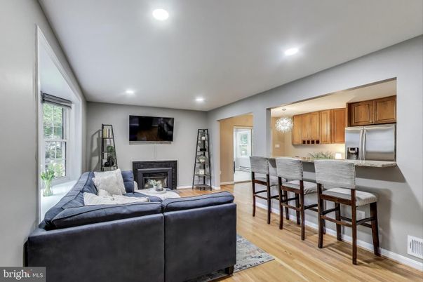 Chandelier, Fireplace, Interior, Kitchen, Living room, Recessed Lighting, Wood Texture Flooring