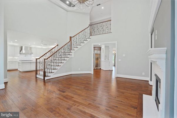 Chandelier, Fireplace, Interior, Kitchen, Recessed Lighting, Wood Texture Flooring