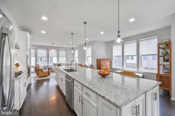 Dining room, Interior, Kitchen, Living room, Pendant Lights, Recessed Lighting, Stainless Steel Appliances, Wood Texture Flooring