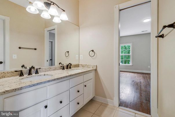 Bathroom, Dual Sink Vanities, Interior, Recessed Lighting, Wood Texture Flooring