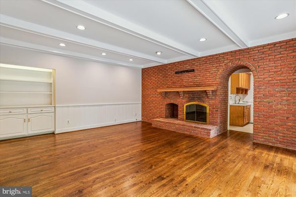 Empty room, Fireplace, Interior, Recessed Lighting, Stone Walls, Wood Texture Flooring