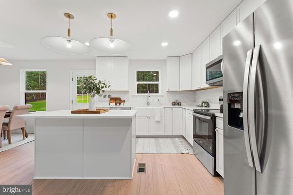 Dining room, Interior, Kitchen, Pendant Lights, Recessed Lighting, Stainless Steel Appliances, Wood Texture Flooring