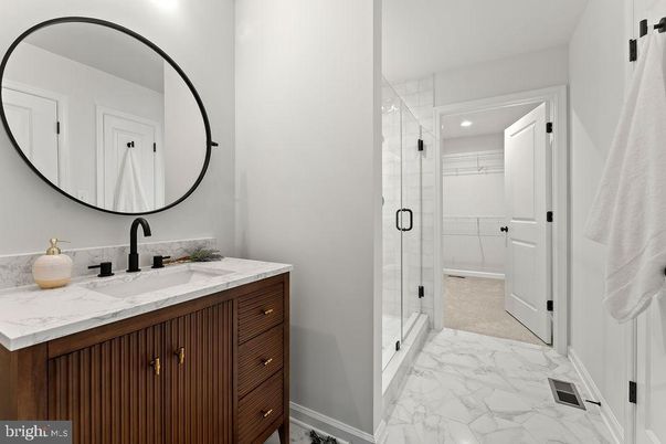 Bathroom, Dual Sink Vanities, Glass Shower, Interior, Marble, Recessed Lighting