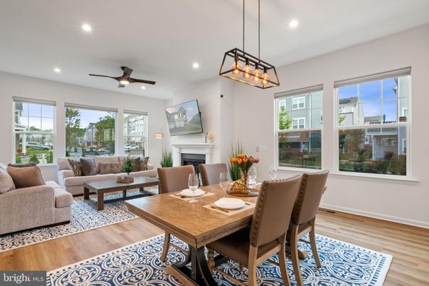 Dining room, Fireplace, Interior, Living room, Pendant Lights, Recessed Lighting, Wood Texture Flooring