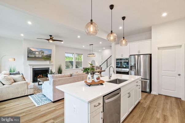 Dining room, Fireplace, Interior, Kitchen, Living room, Pendant Lights, Recessed Lighting, Stainless Steel Appliances, Wood Texture Flooring