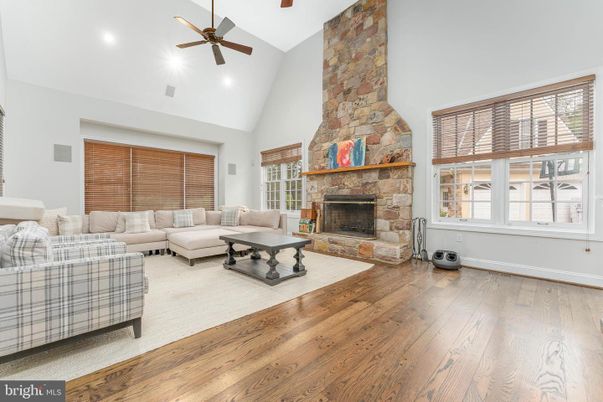 Fireplace, Interior, Living room, Recessed Lighting, Stone Walls, Wood Texture Flooring