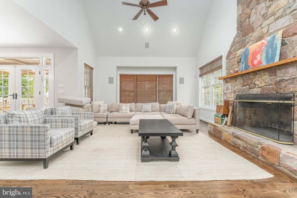 Fireplace, Interior, Living room, Recessed Lighting, Stone Walls, Wood Texture Flooring