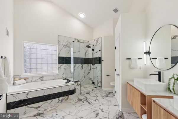Bathroom, Dual Sink Vanities, Glass Shower, Interior, Marble, Marble Walls, Recessed Lighting