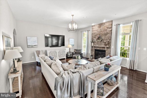 Fireplace, Interior, Living room, Recessed Lighting, Stone Walls, Wood Texture Flooring