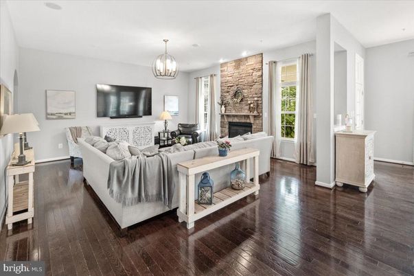 Fireplace, Interior, Living room, Recessed Lighting, Stone Walls, Wood Texture Flooring