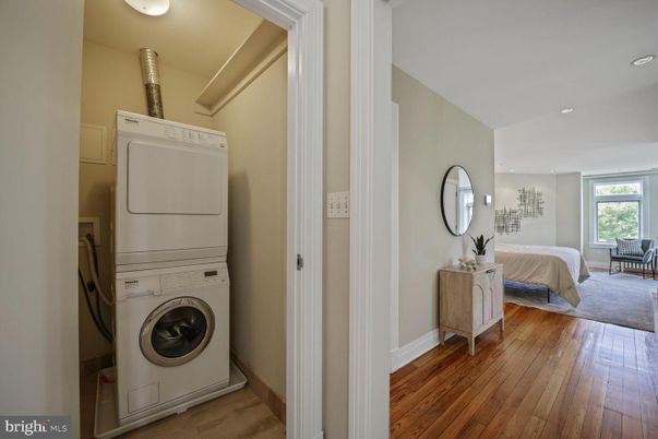 Bedroom, Interior, Recessed Lighting, Utility Closets, Washer, Wood Texture Flooring