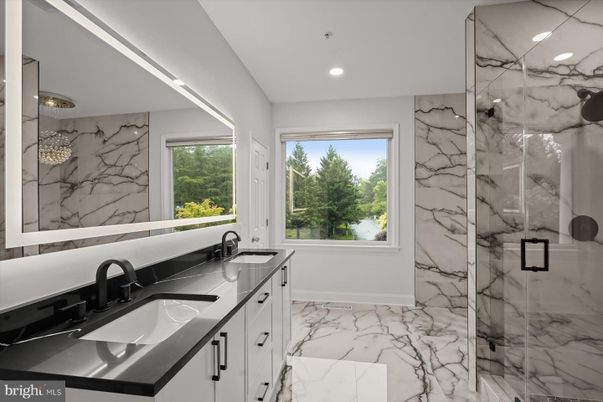 Bathroom, Dual Sink Vanities, Glass Shower, Interior, Marble, Marble Walls, Recessed Lighting