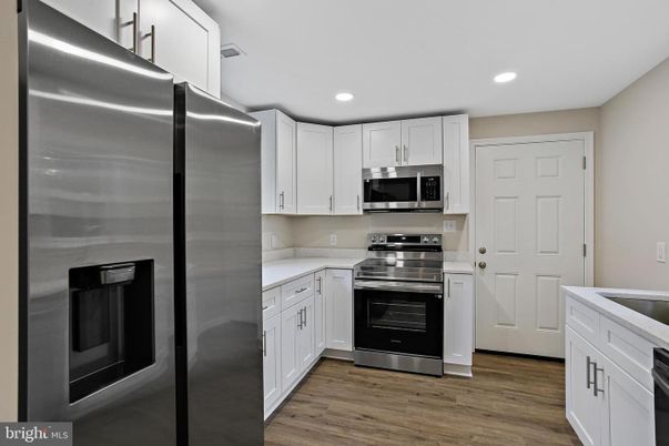 Interior, Kitchen, Recessed Lighting, Stainless Steel Appliances, Wood Texture Flooring