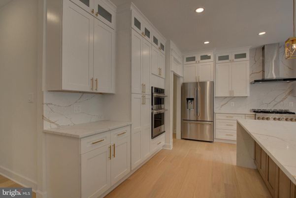 Interior, Kitchen, Marble Walls, Recessed Lighting, Stainless Steel Appliances, Wood Texture Flooring