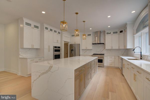 Interior, Kitchen, Marble Walls, Pendant Lights, Recessed Lighting, Stainless Steel Appliances, Wood Texture Flooring