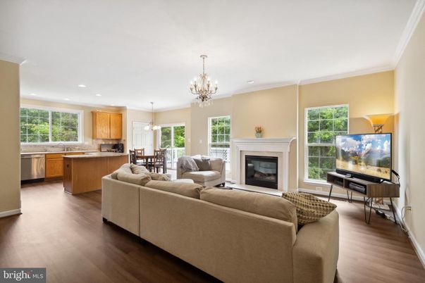 Chandelier, Dining room, Fireplace, Interior, Kitchen, Living room, Pendant Lights, Recessed Lighting, Wood Texture Flooring