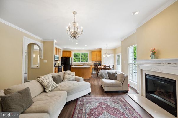 Chandelier, Dining room, Fireplace, Interior, Kitchen, Living room, Pendant Lights, Recessed Lighting, Wood Texture Flooring