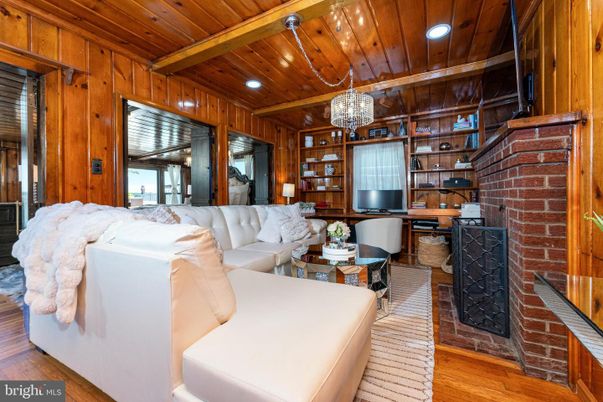 Chandelier, Fireplace, Interior, Living room, Recessed Lighting, Stone Walls, Wooden Beams, Wooden Ceilings, Wood Texture Flooring, Wooden Walls