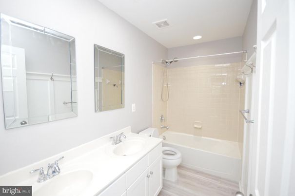 Bathroom, Dual Sink Vanities, Interior, Recessed Lighting, Wood Texture Flooring
