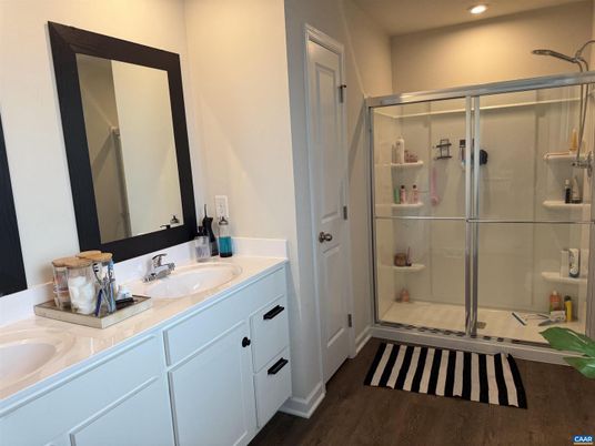 Bathroom, Dual Sink Vanities, Glass Shower, Interior, Recessed Lighting, Wood Texture Flooring