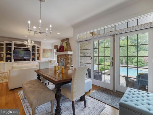 Chandelier, Dining room, Fireplace, Interior, Living room, Pendant Lights, Recessed Lighting, Wood Texture Flooring