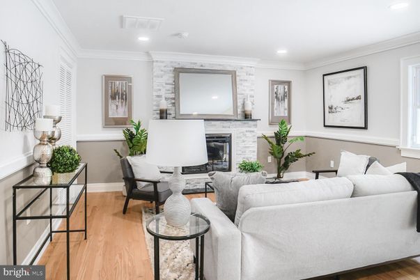 Fireplace, Interior, Living room, Recessed Lighting, Stone Walls, Wood Texture Flooring