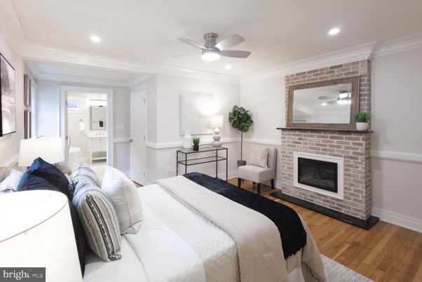 Bedroom, Fireplace, Interior, Recessed Lighting, Stone Walls, Wood Texture Flooring