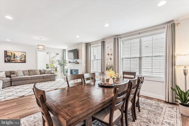 Dining room, Fireplace, Interior, Living room, Pendant Lights, Recessed Lighting, Wood Texture Flooring