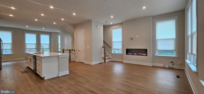 Empty room, Fireplace, Interior, Kitchen, Recessed Lighting, Wood Texture Flooring