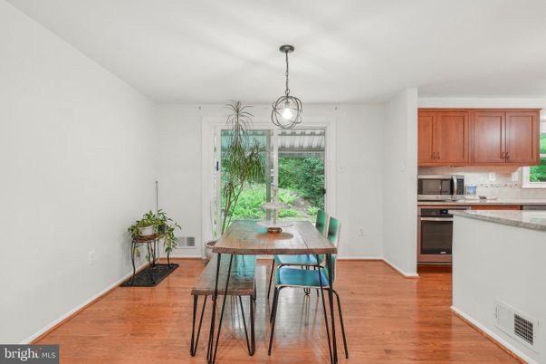 Dining room, Interior, Kitchen, Pendant Lights, Stainless Steel Appliances, Wood Texture Flooring