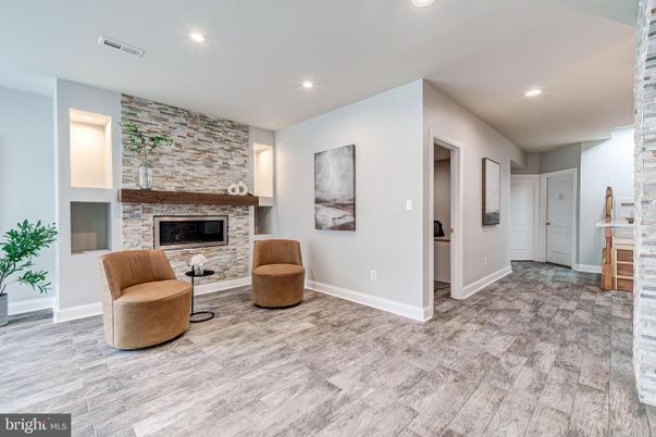 Fireplace, Interior, Recessed Lighting, Stone Walls, Wood Texture Flooring