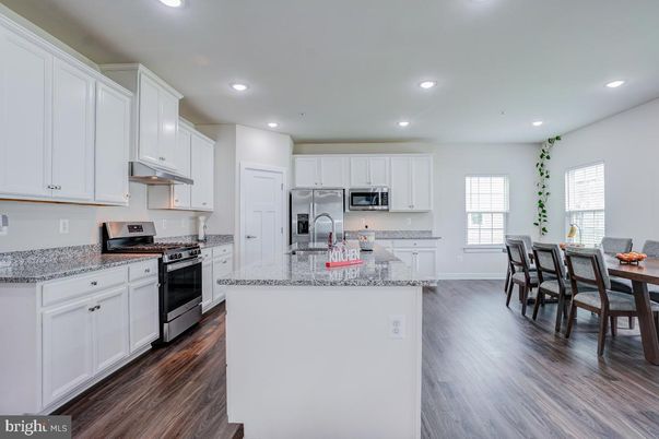 Dining room, Interior, Kitchen, Recessed Lighting, Stainless Steel Appliances, Wood Texture Flooring
