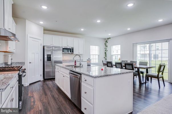 Dining room, Interior, Kitchen, Recessed Lighting, Stainless Steel Appliances, Wood Texture Flooring