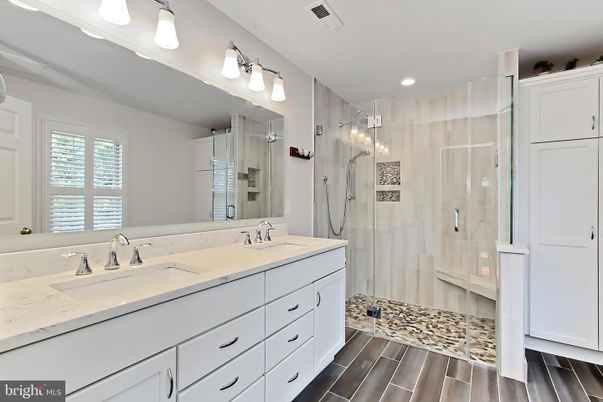 Bathroom, Dual Sink Vanities, Glass Shower, Interior, Recessed Lighting, Wood Texture Flooring