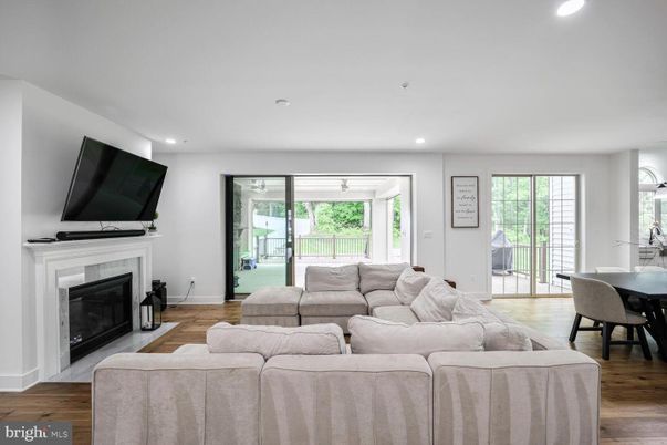 Dining room, Fireplace, Interior, Living room, Recessed Lighting, Wood Texture Flooring